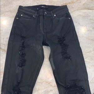 Black coated ripped jeans